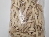 a bag of rubber bands on a white table