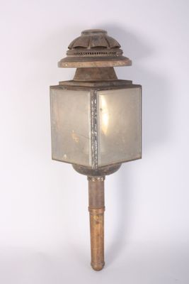 a light that is on top of a wooden pole