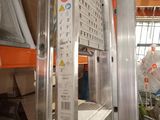 a picture of a kitchen with a lot of items on the shelves