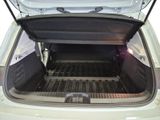 the back of a car with its trunk open showing the cargo compartment