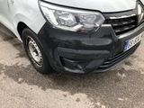 a white van that has been damaged and is parked in a parking lot
