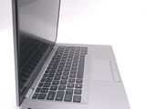 a close up of a laptop computer on a white surface