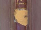 an old book with a brown cover sitting on top of a white table