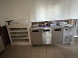 an image of a kitchen with a stainless steel counter top