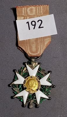a medal with a star on it and a ribbon around it
