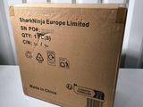 the box is sitting on the table next to the wall