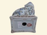 a birdhouse with a pillow on top of it