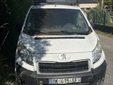 a white van that is parked on the side of the road
