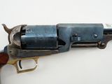 a close up of a revolver with a tag on it