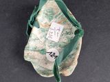a bag with a tag on it sitting on a table