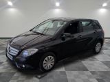 the mercedes b - class is parked on a checkered tile floor