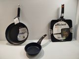 two frying pans and a frying pan on the counter