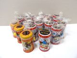 a lot of small tins that are sitting on a table