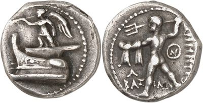 a silver coin with an image of a man and a woman on it