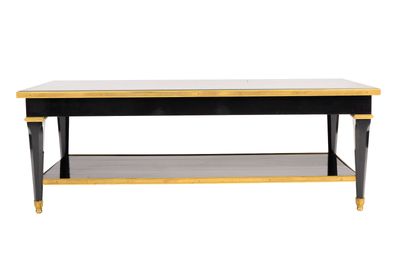 a black and gold coffee table with a shelf underneath it