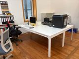 a white desk with a printer on it in a room