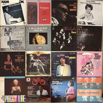 a lot of records on the wall of a room