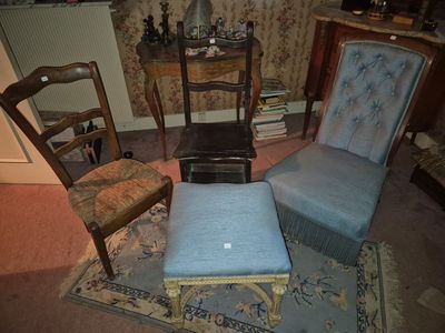 two chairs and a foot stool in a living room