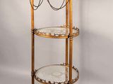 an image of a three tiered glass and brass plate display stand