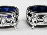 pair of silver and blue glass bowls on stand