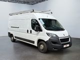 a white van that is parked in a large room