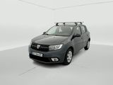the grey car is parked in a white room with a roof rack