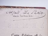 an open book with writing on it sitting on top of a table