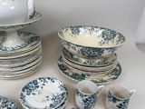 a lot of dishes and cups on the table