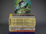 a stack of books sitting on top of each other on a table