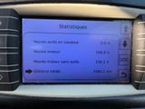the dashboard of a car with a blue screen displaying the time