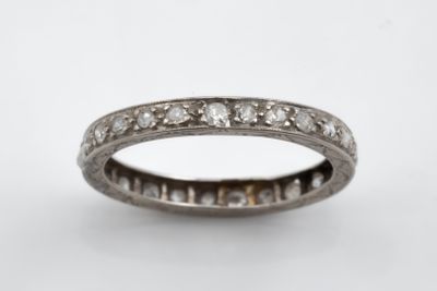 a close up of a diamond ring on a white background