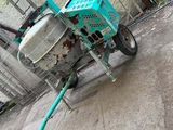 a small machine that is sitting on the sidewalk