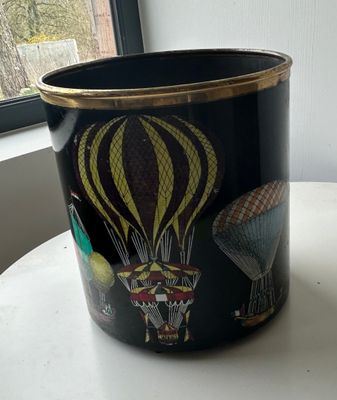 a black trash can with a picture of hot air balloons on it