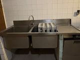 an image of a kitchen with a sink and a stove