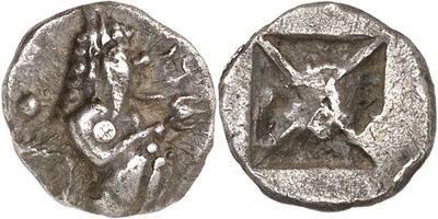 a close up of a silver coin with a woman on it