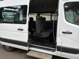 a white van with its doors open in a parking lot