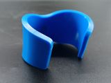 a close up of a blue plastic object on a table