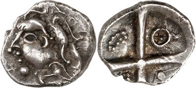 a silver coin with an image of a man ' s face on it