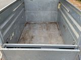 an image of a truck with a flat bed in the back