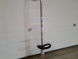 an image of a pole sawing machine in a garage