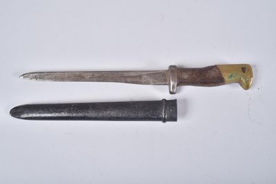 an old knife and a small knife on a white surface