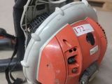 a chainsaw that is sitting on the floor