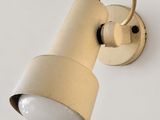 a close up of a light on a wall with a white background