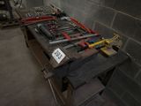 many tools on a workbench in a room