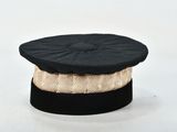 a black hat with a gold band around it