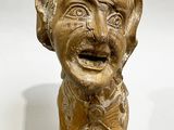 statue of a man with a hat on his head and a mustache