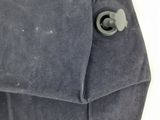 a close up of a bag with a button on it