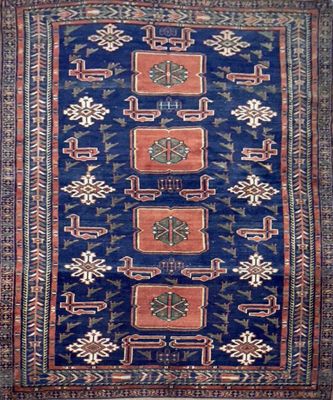 a blue and red rug with a design on it