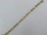 a gold chain bracelet with a clasp on a white background