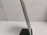 a tablet that is sitting on a stand on the table